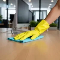 Corporate office deep cleaning service showing spotless desk wiping by SKKS professional