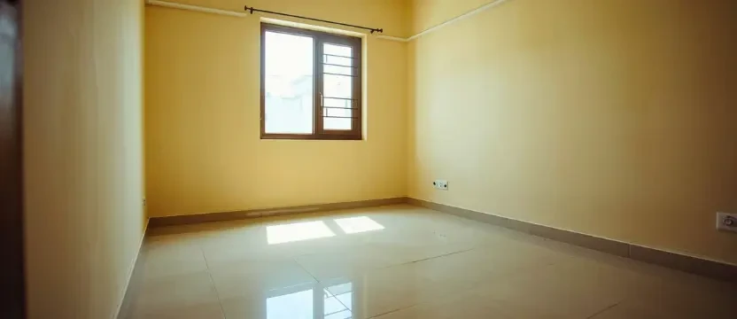 Freshly mopped and highly hygienic unfurnished flat interior ready for new residents.